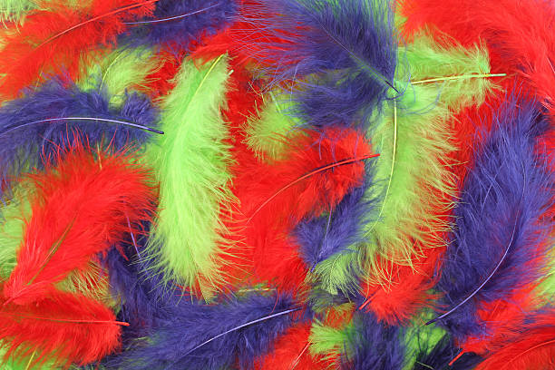 istock Background - small red, blue, green plumes situated irregularly 506134576