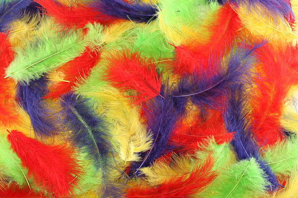istock Background - small red, blue, green, yellow plumes situated irregularly 506134640