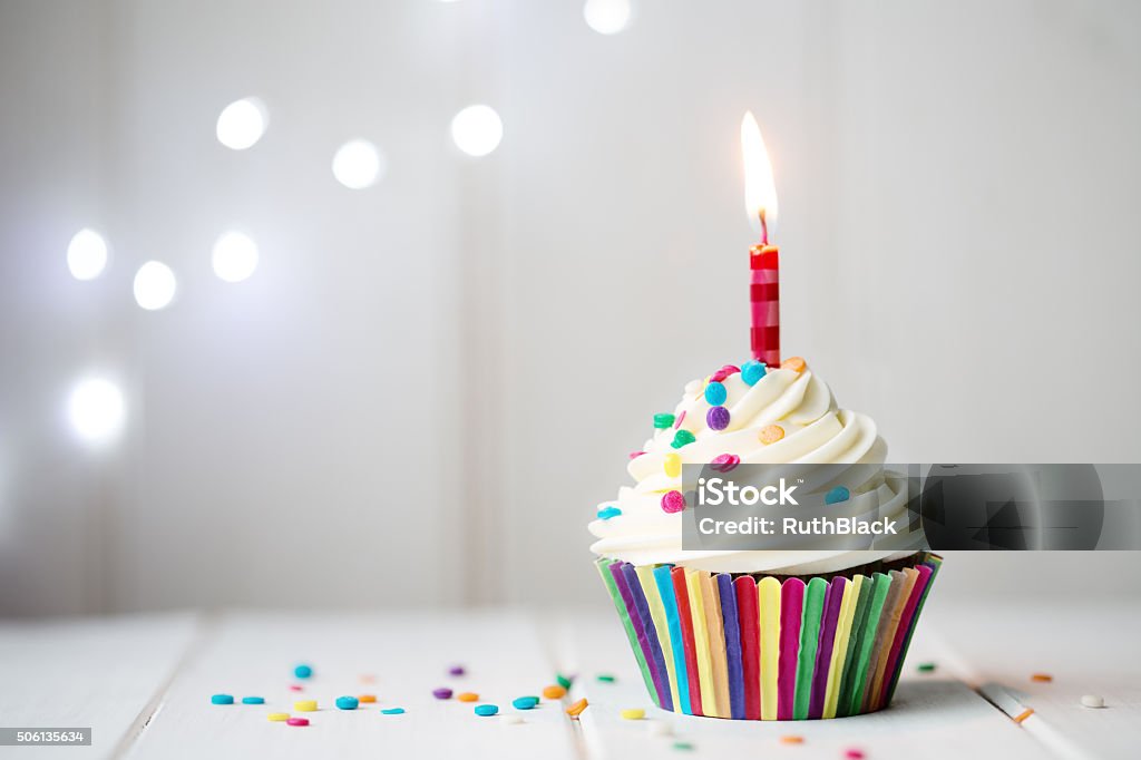 Birthday cupcake Cupcake with a single candle Birthday Stock Photo