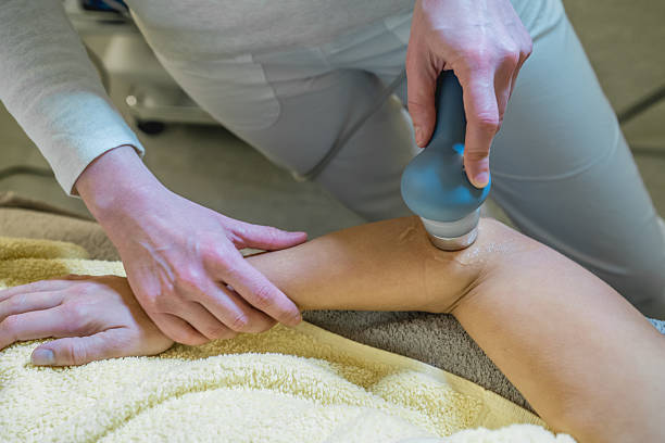 istock Physical Therapist Using Ultrasound Probe on Woman's Arm, Close up 506136668