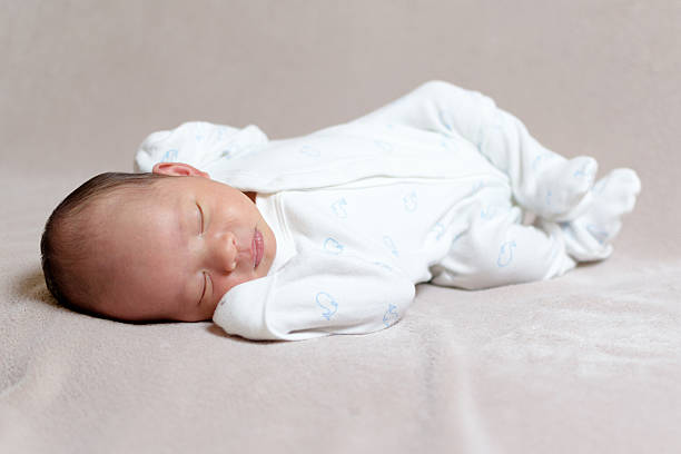istock Chinese newborn baby sleeping on his back 506137014