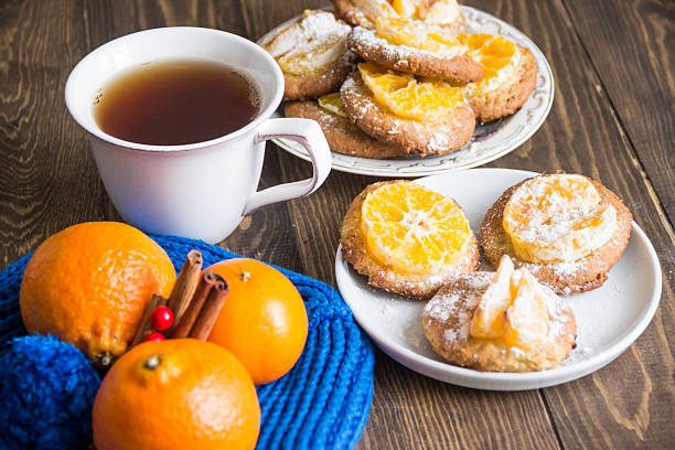 istock Tangerine cookie, Cup of tea and tangerines 506137054