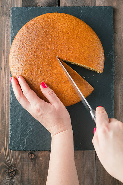 istock Woman hands cutting manna pie 506137116