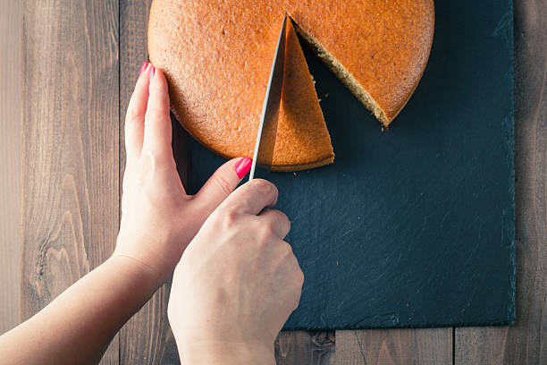 istock Woman hands cutting manna pie 506137158