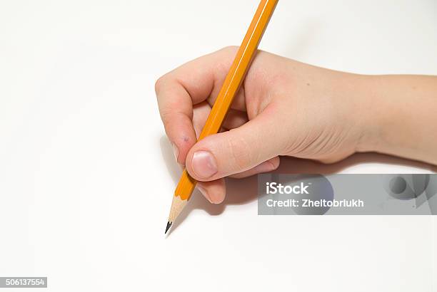 Kids Rigth Hand Holding A Pencil On Over White Stock Photo - Download Image Now - Blade, Calligraphy, Correspondence