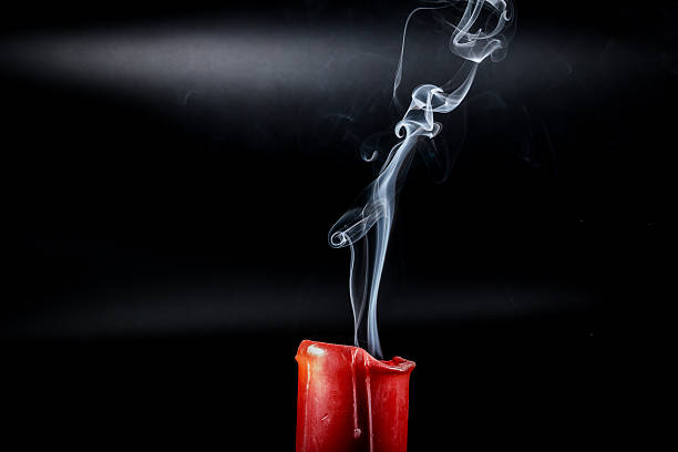 istock gray smoke flying upside from the extinct red candles 506138588