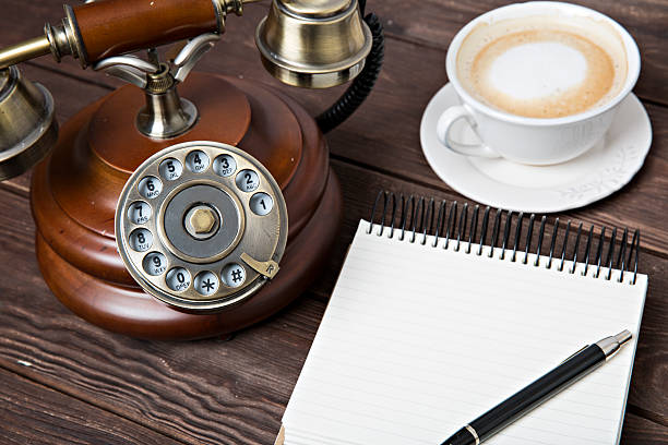 istock Notebook with a pen next to coffee and telefon 506138828