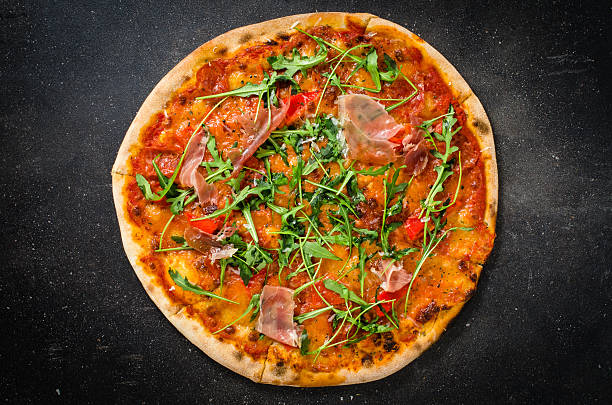 istock Italian pizza on dark background 506143648