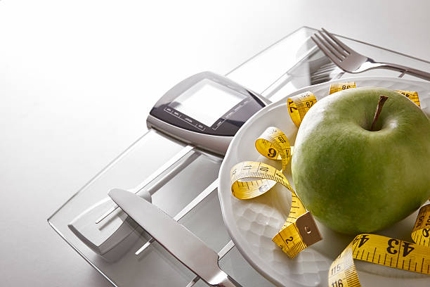 istock Concept healthy food on table with apple elevated view 506143912