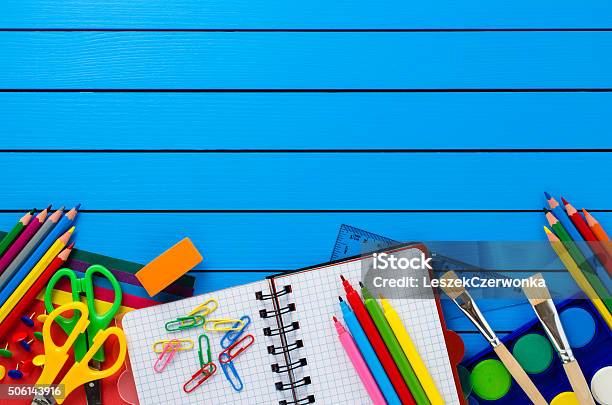 School Supplies On Wooden Table Stock Photo - Download Image Now - Back to School, Backgrounds, Blue