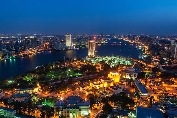 City skyline - Cairo at dusk A cityscape of the downtown area of Cairo, capital city of Egypt - aerial view. egypt skyline stock pictures, royalty-free photos & images