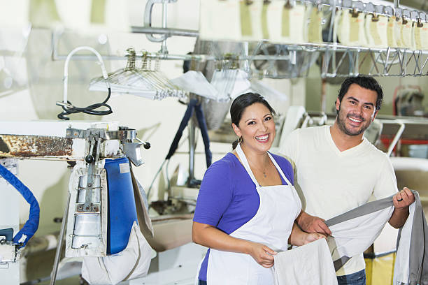 istock Hispanic couple working in dry cleaner 506144480