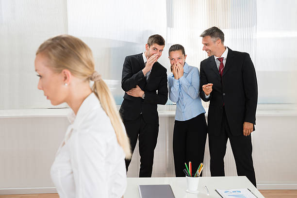 istock Businesspeople Whispering About Woman 506145042