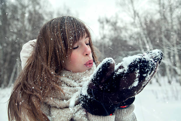 istock Attractive blondy woman blowing snow on herself. 506146002