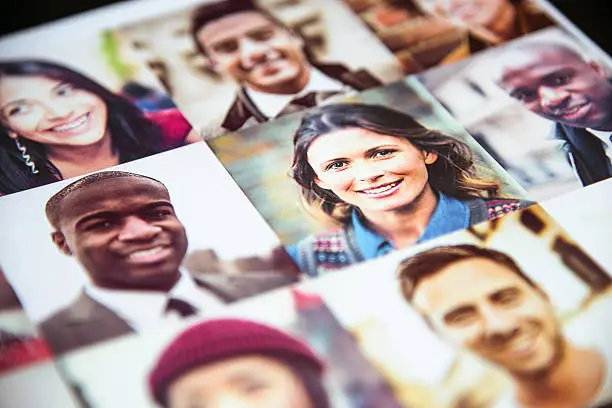 Photo of Outlay of multiracial faces printed