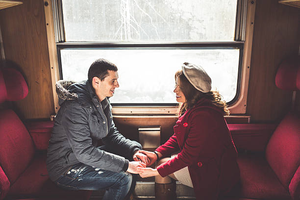 istock Happy couple traveling by train 506147096