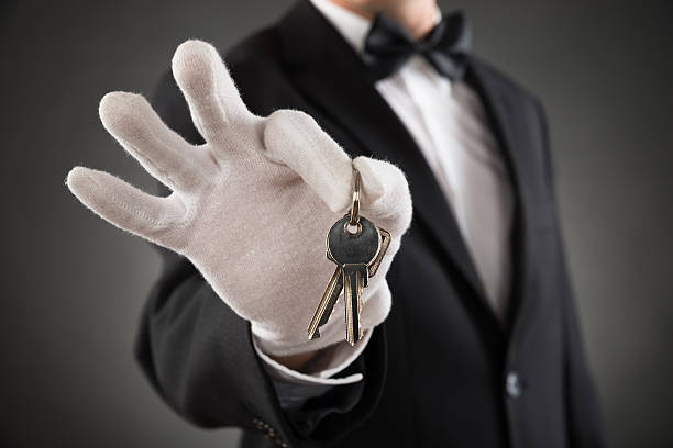istock Close-up Of Waiter Holding Keys 506147308