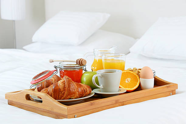 istock Breakfast in bed in hotel room. 506149382