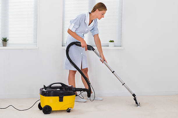 istock Female Maid Cleaning With Vacuum Cleaner 506149402