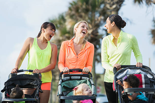 istock Multi-racial mothers with babies in jogging strollers 506150284
