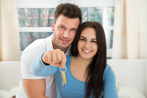 istock Loving Couple Holding House Keys 506150408