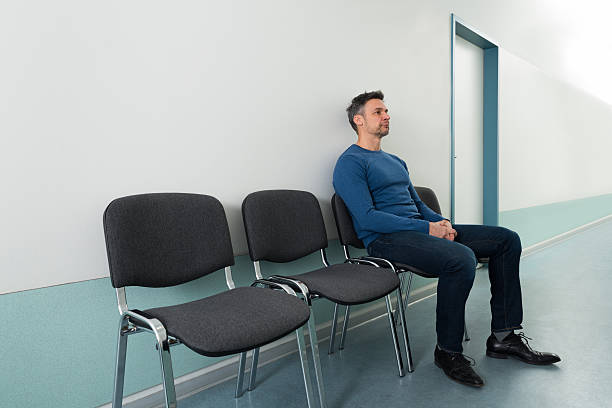 istock Man Sitting On Chair In Hospital 506150632