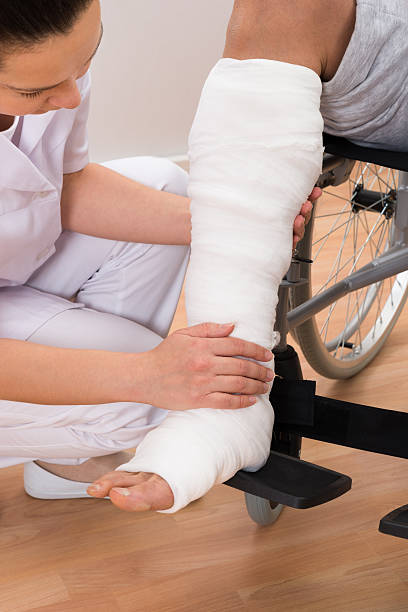 istock Female Doctor Holding Patient's Leg 506150766