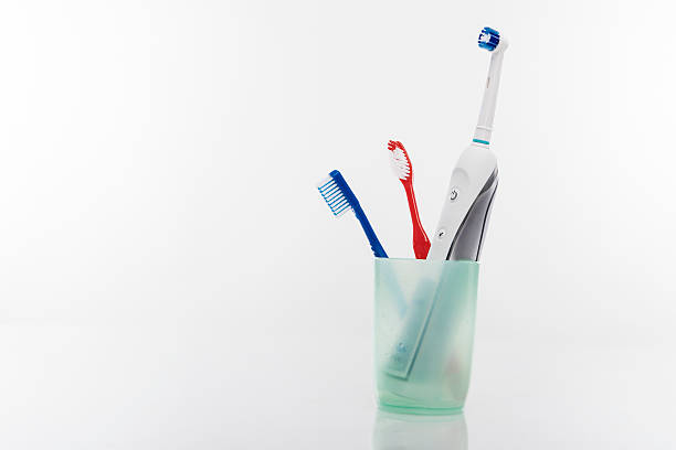istock Electric and Manual Toothbrushes in One Cup Together 506151531