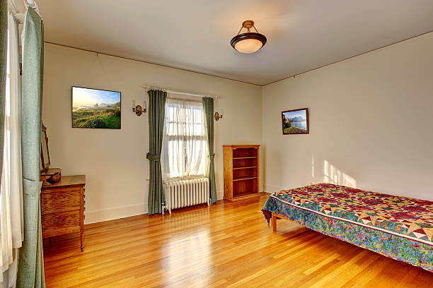 istock Simple bedroom interior with hardwood floor 506153055