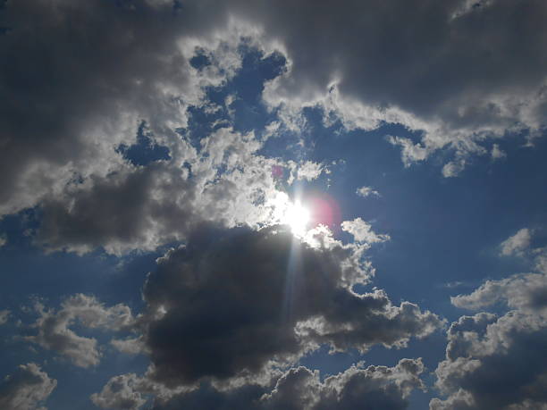 istock Sun Shining through Clouds on Coney Island. 506153181