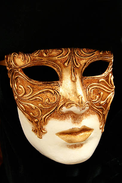 istock Gold Venetian Carnival Mask on Black Background with Copy Space 506155835
