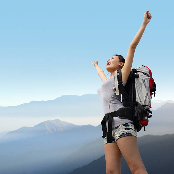 istock happy woman mountain hiker 506157993