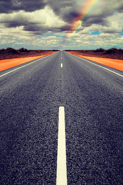 istock Long Straight Road with Gathering Storm Clouds 506158143