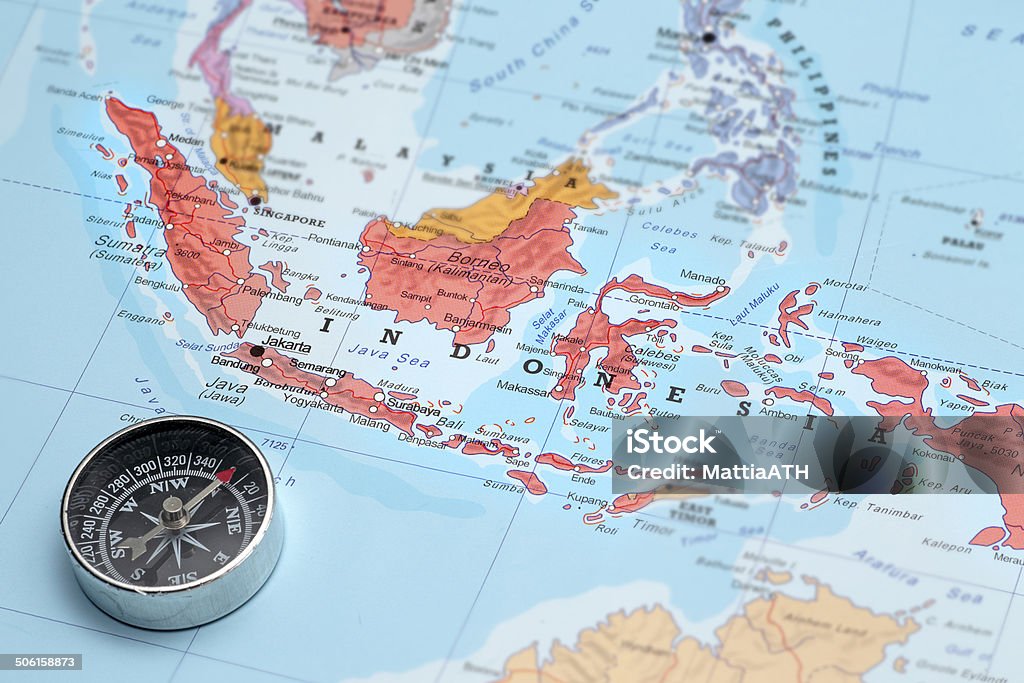 Travel destination Indonesia, map with compass Compass on a map pointing at Indonesia and planning a travel destination Indonesia Stock Photo