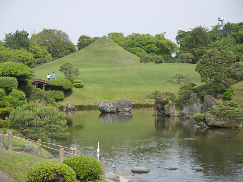 Suizenji Garden - Traditional japanese garden in Kumamto city, Japan. Fuji Mountain replica in the background.