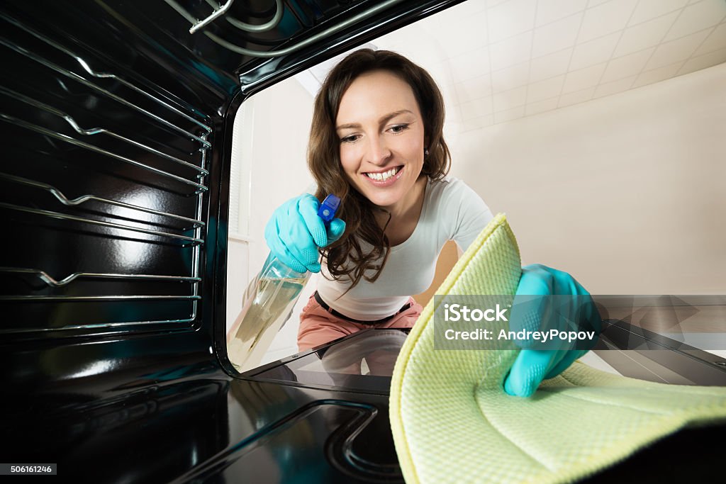 Woman Cleaning View From Inside The Oven Young Happy Woman Cleaning View From Inside The Oven Adult Stock Photo