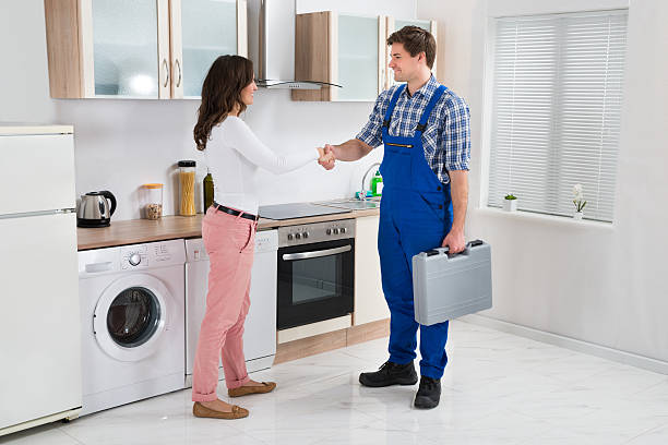 istock Repairman Shaking Hands With Woman 506161576