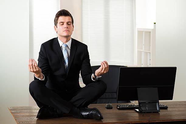 istock Businessman Doing Meditation In Office 506162774