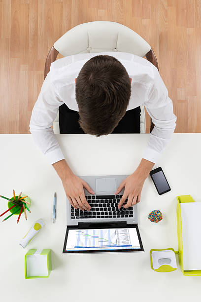 istock Businessman Working On Laptop Showing Gantt Chart 506163202