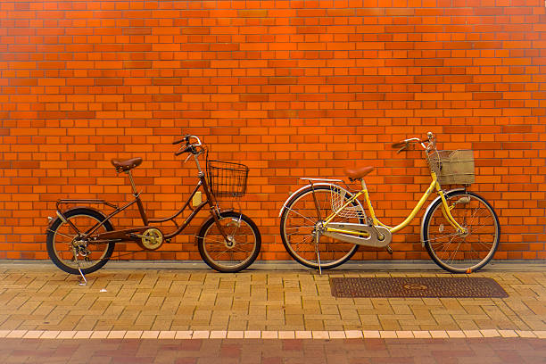istock Two city bicycle and red brick wall. 506163252