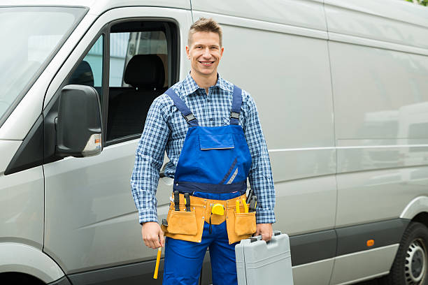 istock Repairman With Tools And Toolbox In Front Of Van 506164746