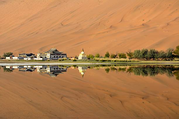 istock Badain Jaran Temple, reflecting on its lake, Inner Mongolia 506165854
