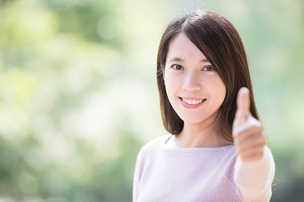 istock young woman smile thumb up 506169004