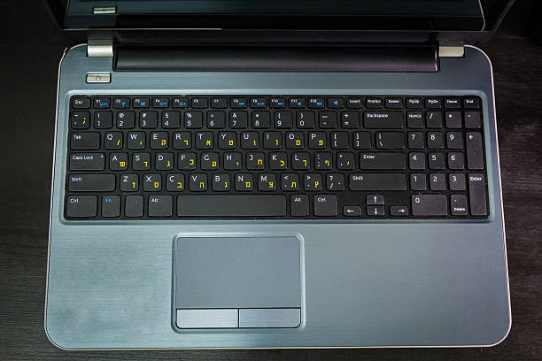 istock Keyboard with letters in Hebrew and English 506172808