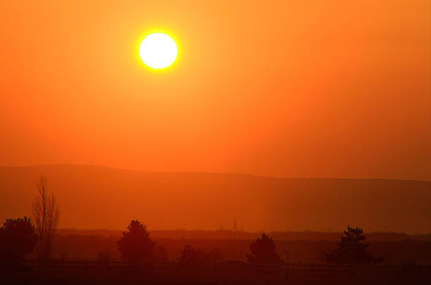 istock sunrise with mountain and village landscape 506174020