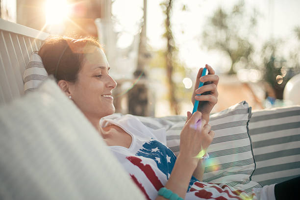 istock Woman texting at the veranda 506176272