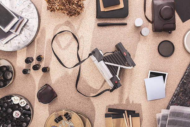 istock Polaroid Camera on a Photographers Desktop. Vintage. Darkroom 506178300