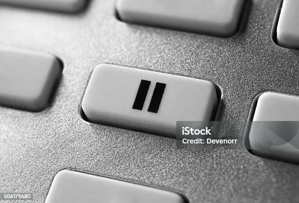 Close Up Of Grey Pause Button On Chrome Remote Control Stock Photo - Download Image Now