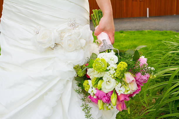 istock Bride Holding Bouquet of Flowers 506187055