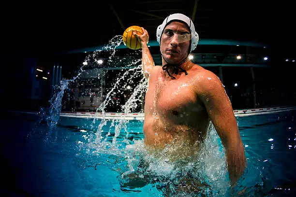 water polo player in swimming pool